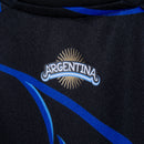 Camisa Reserva da Argentina 2026/2027 Adidas Masculina preta e azul com estampa Fileteado Porteño e patch de Campeão do Mundo FIFA 2022.